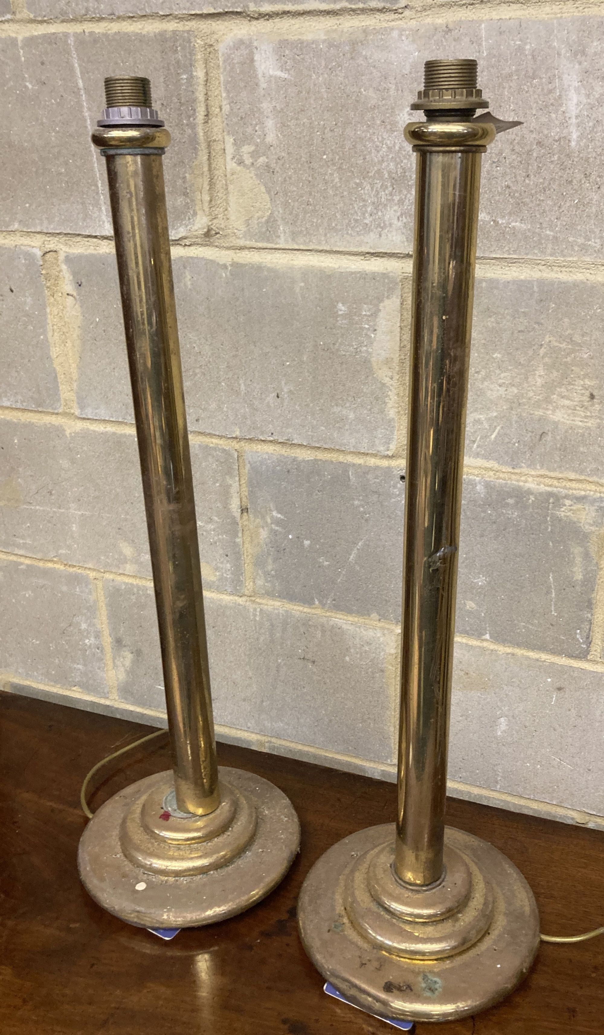 A pair of brass floor lamps, formerly from the Brighton Grand, height 80cm